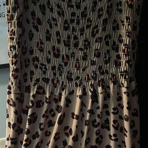 One piece jumpsuit.  Animal print. Turn heads in this like new number!